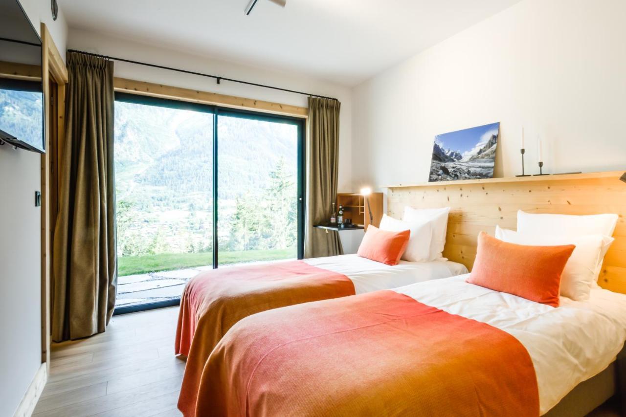 Le Chalet Mont Blanc เลอุชส์ ภายนอก รูปภาพ
